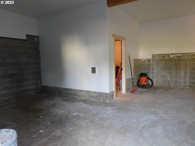 garage with visible vents and concrete block wall