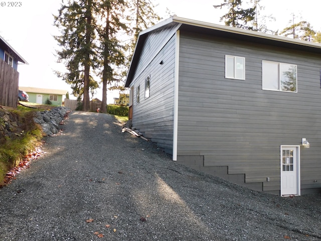 view of side of home with fence