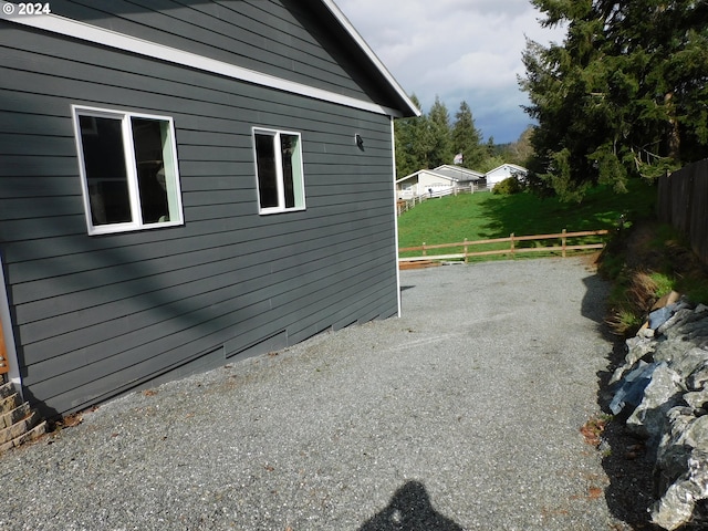 view of side of property with fence