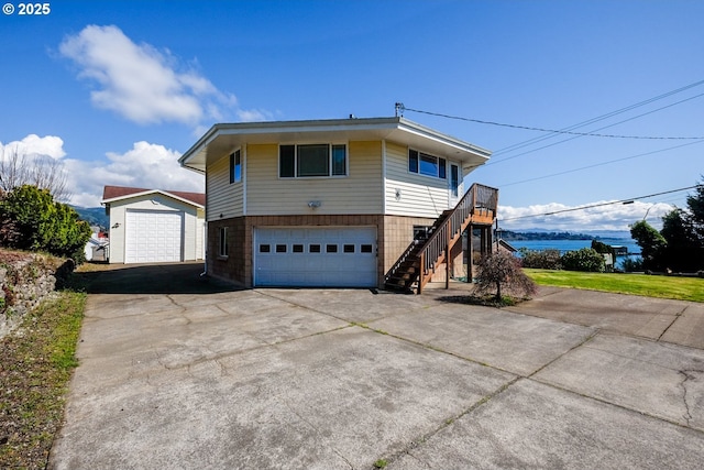 view of front of house with driveway and stairs
