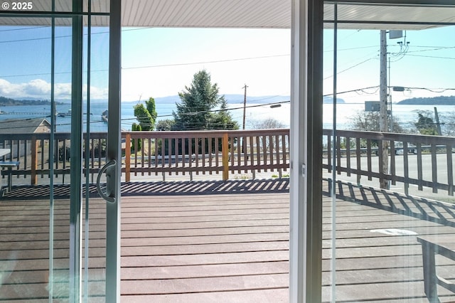 wooden deck with a water view