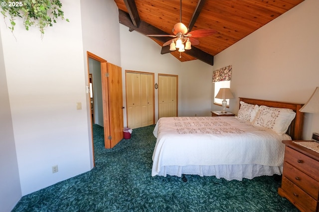 carpeted bedroom with a ceiling fan, wooden ceiling, high vaulted ceiling, beamed ceiling, and multiple closets