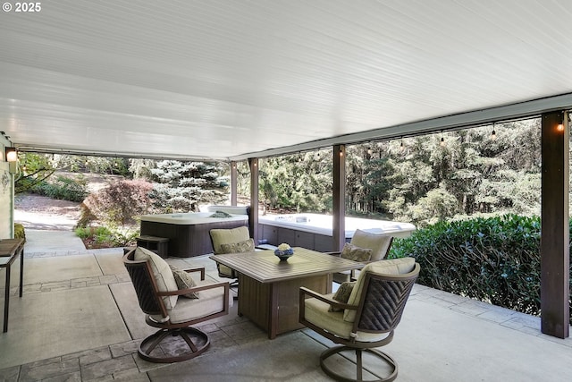 view of patio / terrace featuring a hot tub