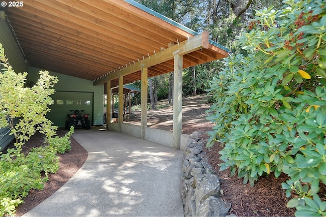 view of patio featuring concrete driveway