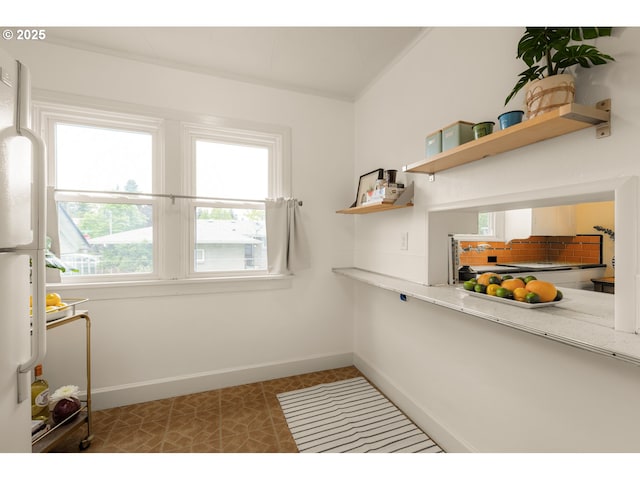 interior space featuring baseboards