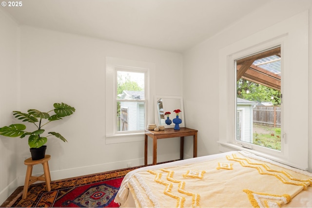 bedroom featuring baseboards