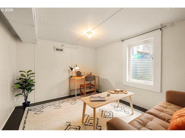 home office with baseboards and visible vents