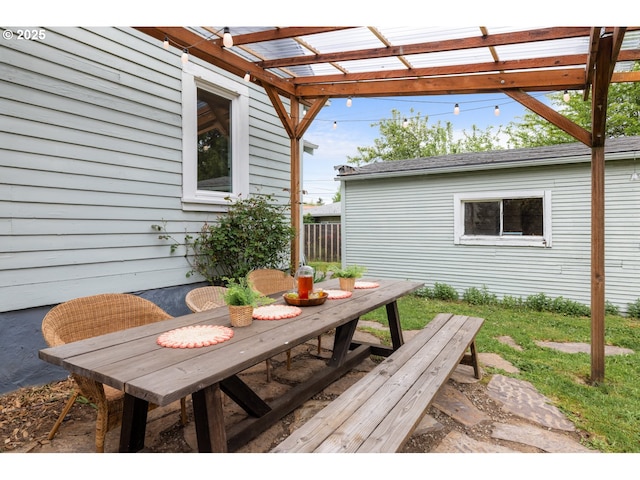 view of patio with a pergola and outdoor dining area