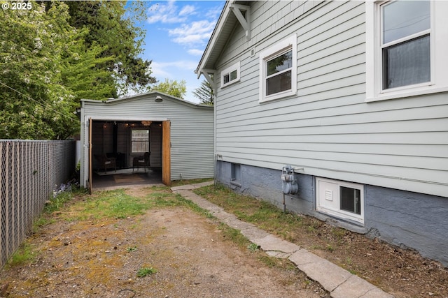 view of side of home with fence