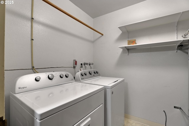 laundry room with washer and dryer and laundry area
