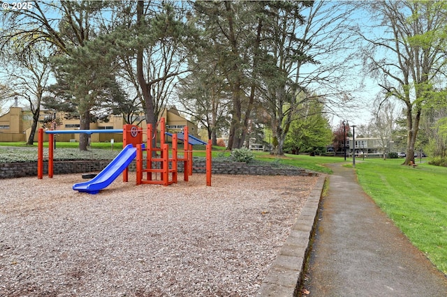 community jungle gym featuring a yard
