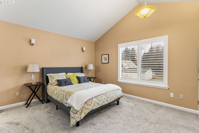 carpeted bedroom featuring vaulted ceiling