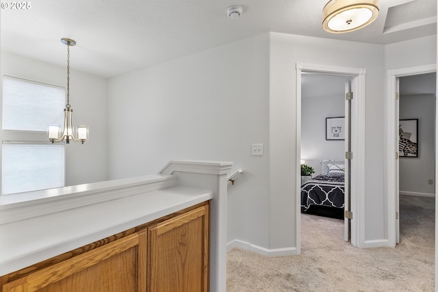 bathroom featuring an inviting chandelier