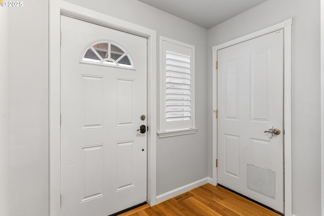 entryway with light hardwood / wood-style floors