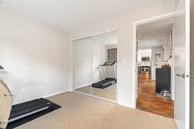16190 SW Theresa Ct, Beaverton, OR 97007 - workout room featuring carpet floors and baseboards