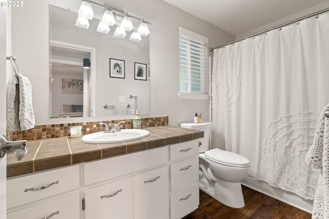 16190 SW Theresa Ct, Beaverton, OR 97007 - bathroom featuring toilet, vanity, wood finished floors, and a shower with curtain