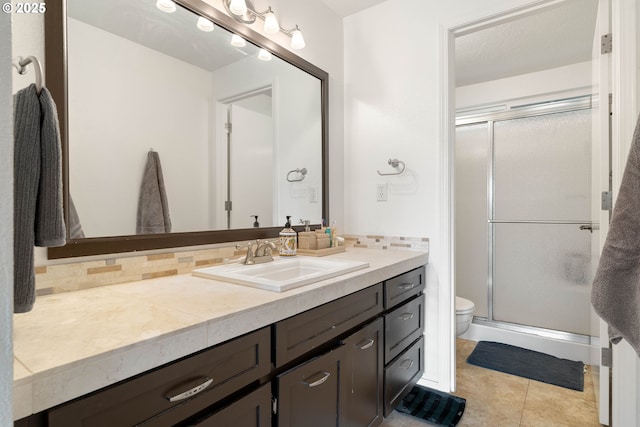 16190 SW Theresa Ct, Beaverton, OR 97007 - full bathroom featuring toilet, vanity, a stall shower, and tile patterned floors