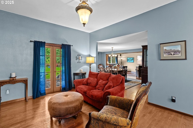9440 SW Washington Dr, Portland, OR 97223 - living room with wood finished floors, plenty of natural light, and a chandelier