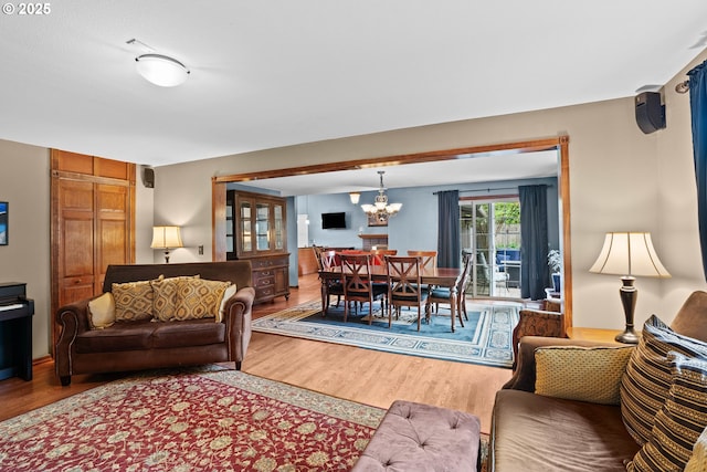 9440 SW Washington Dr, Portland, OR 97223 - living room with wood finished floors and a chandelier