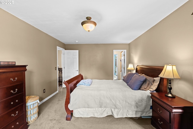 bedroom featuring carpet floors and baseboards