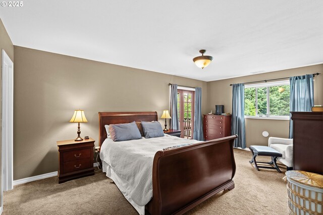 carpeted bedroom featuring baseboards