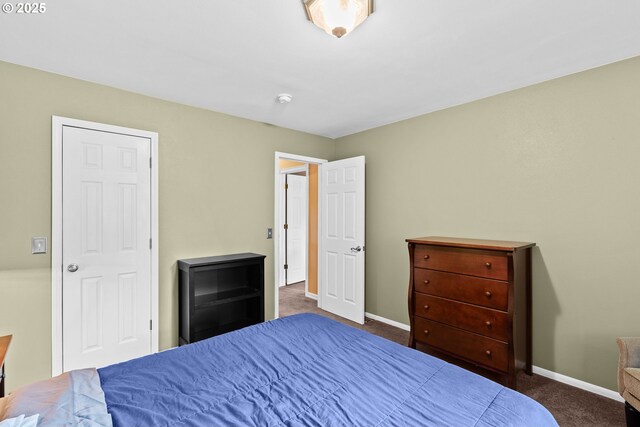 bedroom with carpet flooring and baseboards