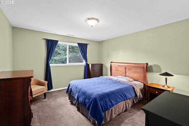 carpeted bedroom featuring baseboards