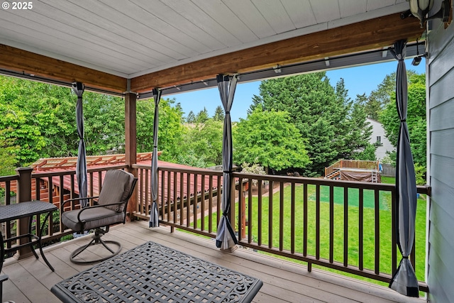 deck featuring a yard