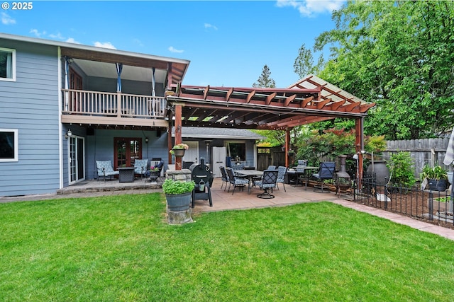 rear view of house with a pergola, a patio, and an outdoor living space