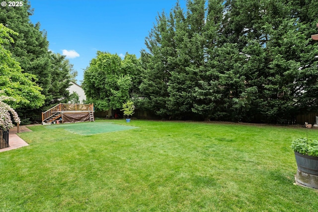9440 SW Washington Dr, Portland, OR 97223 - view of grassy yard featuring a wooden deck and stairs