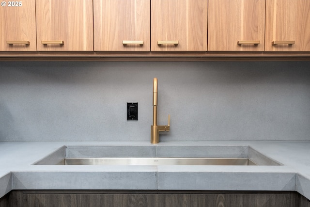 interior space featuring sink and light brown cabinets