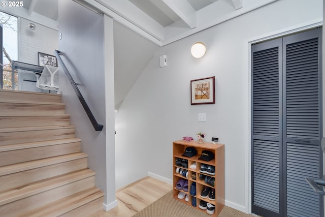 stairs featuring wood-type flooring