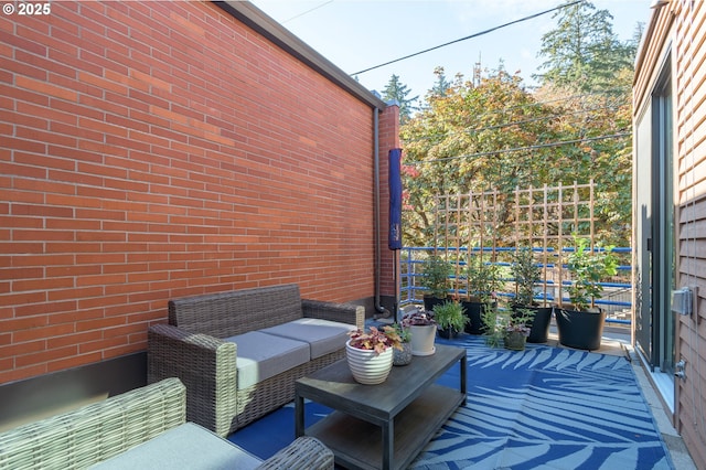 view of patio featuring a balcony