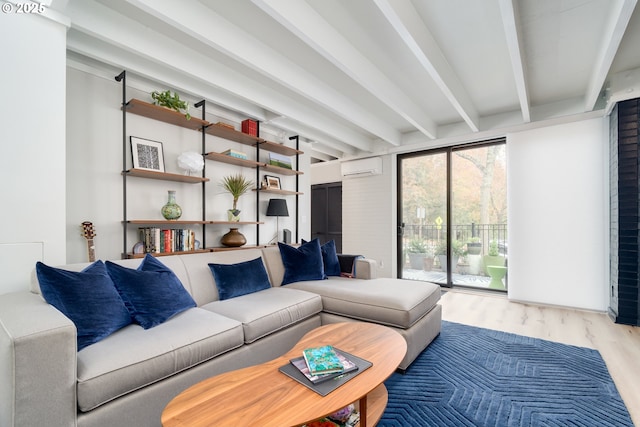 living room featuring hardwood / wood-style flooring, an AC wall unit, and beam ceiling