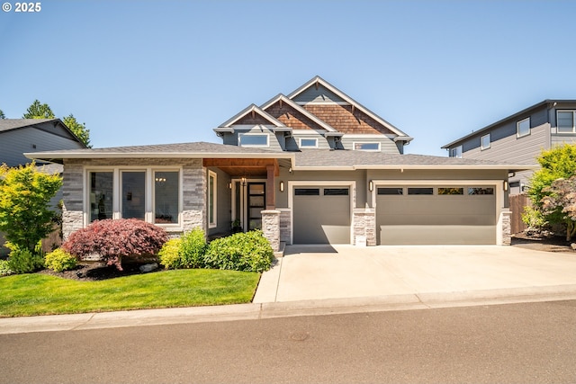 4148 S 11th Cir, Ridgefield, WA 98642 - view of front facade featuring a garage, driveway, and stone siding