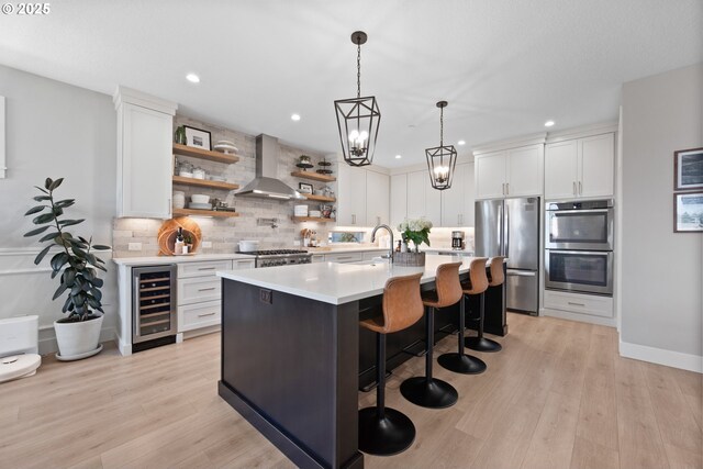 4148 S 11th Cir, Ridgefield, WA 98642 - kitchen featuring stainless steel appliances, beverage cooler, wall chimney exhaust hood, open shelves, and decorative backsplash