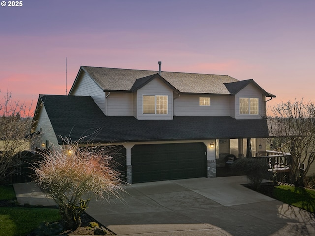 1617 NE 1st St, Battle Ground, WA 98604 - view of front of home with a garage, concrete driveway, a shingled roof, and a porch
