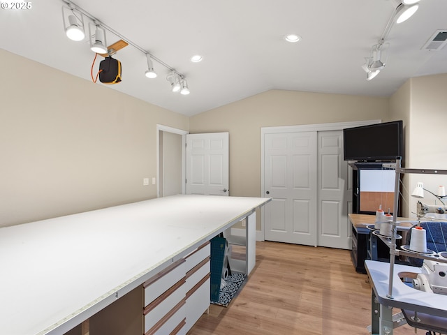 1617 NE 1st St, Battle Ground, WA 98604 - kitchen featuring vaulted ceiling, light wood-style floors, track lighting, light countertops, and an office area