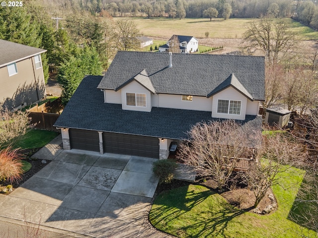 1617 NE 1st St, Battle Ground, WA 98604 - view of front facade featuring roof with shingles, driveway, and an attached garage
