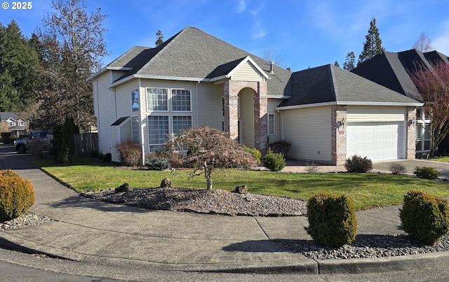 view of front of property with a garage and a front lawn