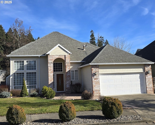 view of front of home featuring a garage and a front lawn