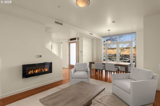 living room with light hardwood / wood-style floors