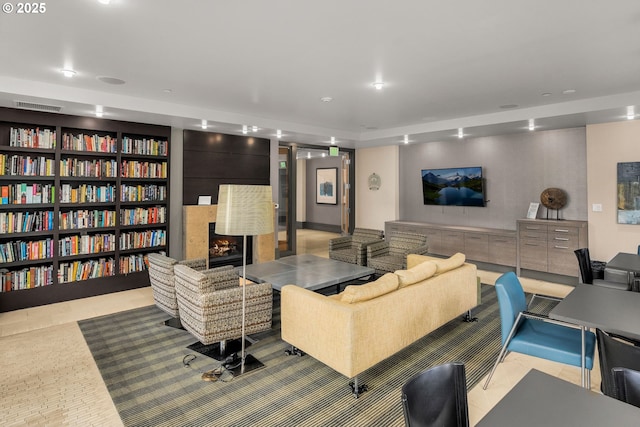 tiled living room with a large fireplace