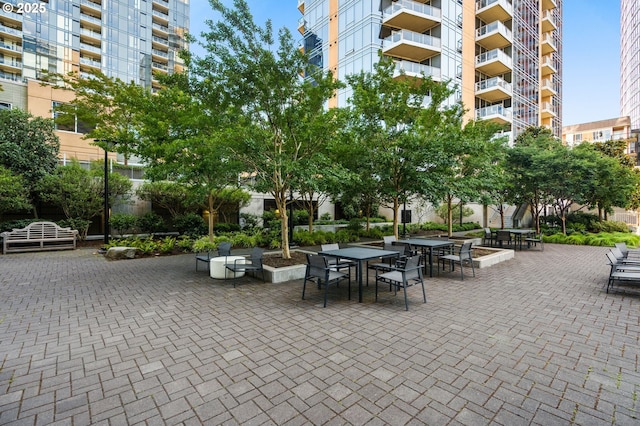 surrounding community featuring a patio