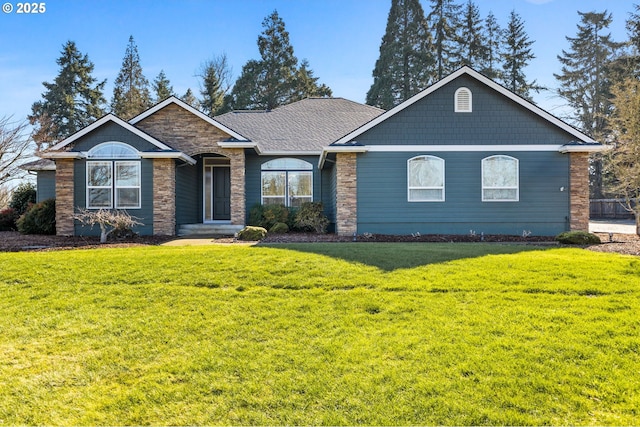 view of front of home with stone siding and a front yard