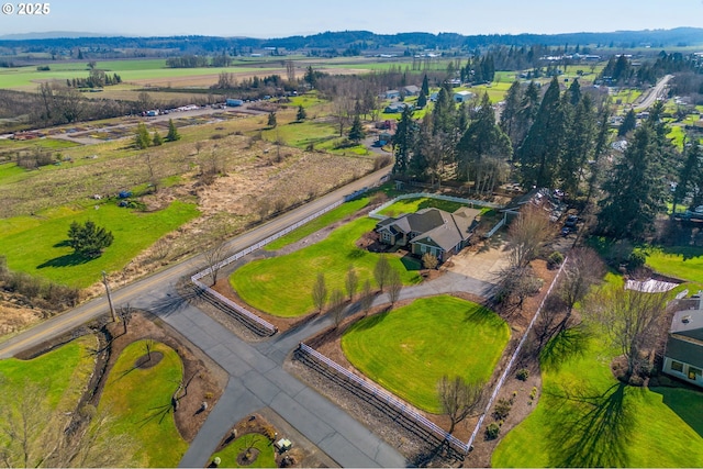 birds eye view of property featuring a rural view