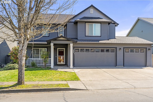 view of front of home featuring a front yard, roof with shingles, a porch, and concrete driveway