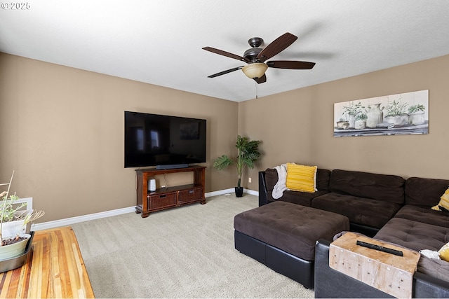 living room with carpet floors, ceiling fan, and baseboards