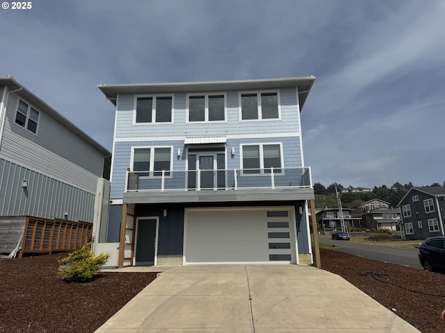 6604 NE Logan Rd, Lincoln City, OR 97367 - coastal home with a balcony, driveway, and a garage