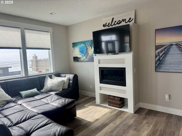 6604 NE Logan Rd, Lincoln City, OR 97367 - living room with wood finished floors and a textured ceiling